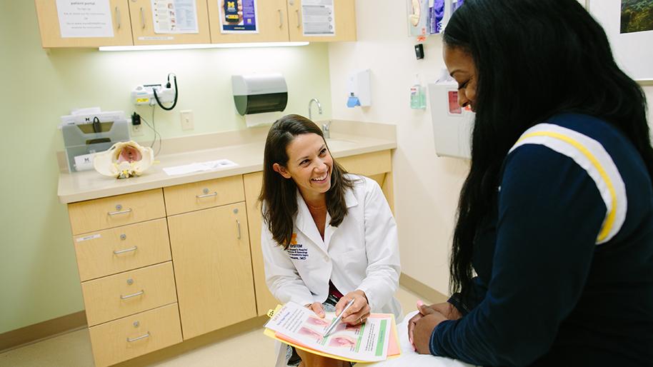 Doctor with a patient in an exam room